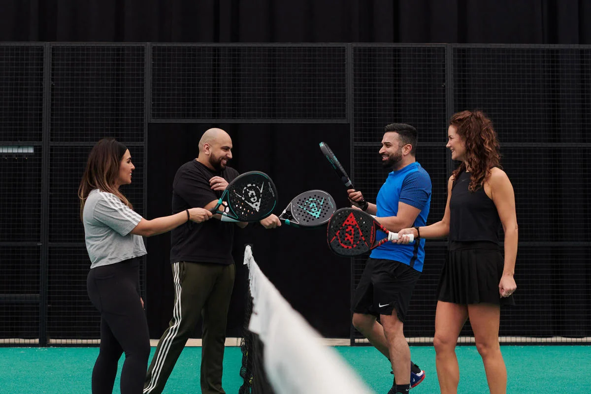 A diverse group of padel players at DOME PADEL